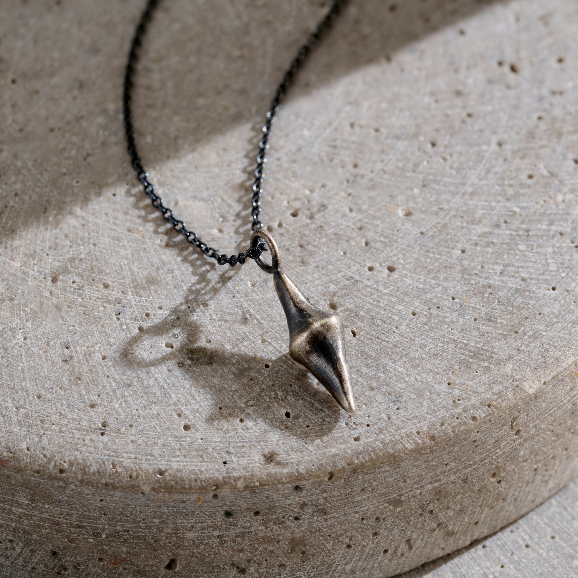 Men's Lucky Spinning Stone Necklace in oxidised silver finish
