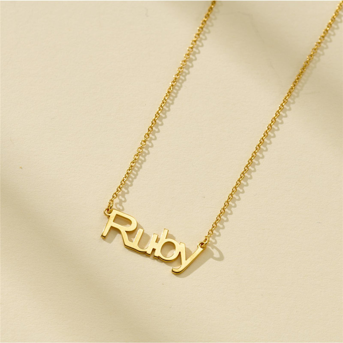 Fine name necklace with the name Ruby in yellow gold plating