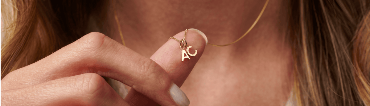 Personalised interlocking Russian rings on cream fabric