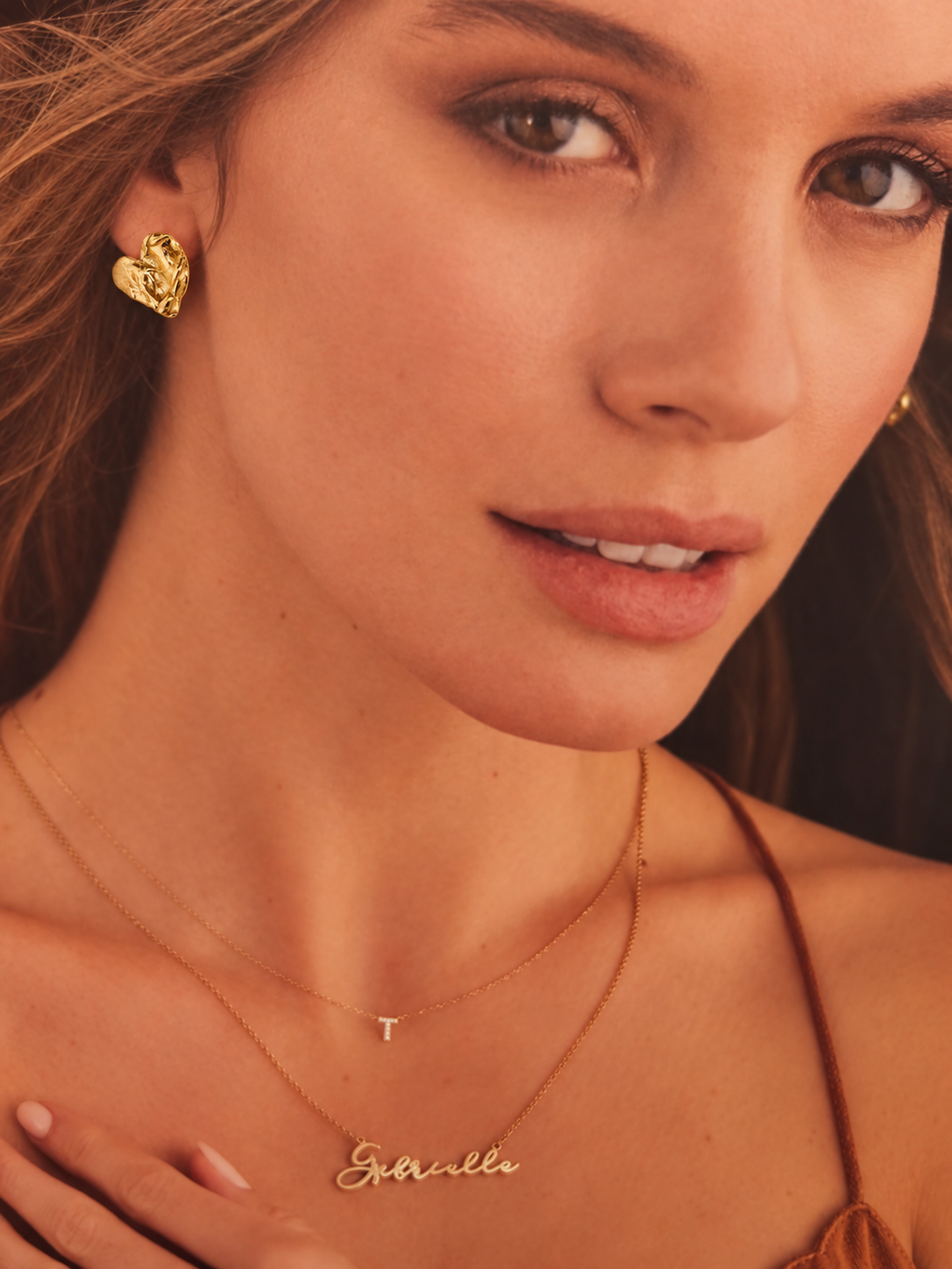 Gold Fortune Heart Stud Earrings worn by a model