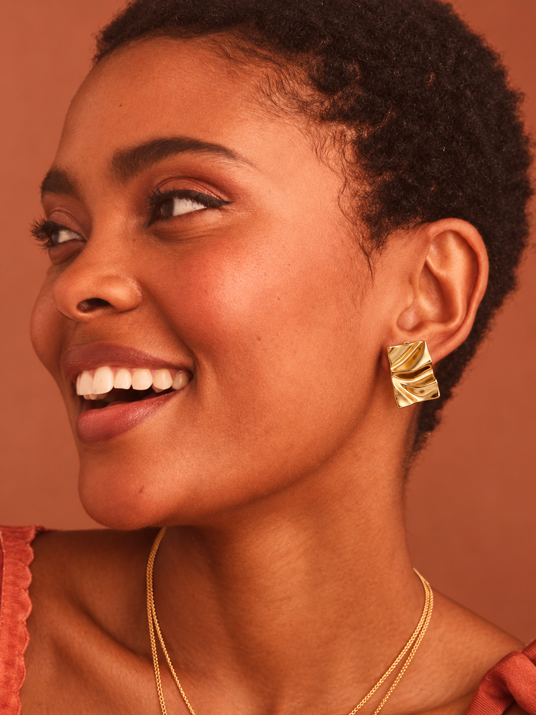 Gold Fortune Square Stud Earrings worn by a model