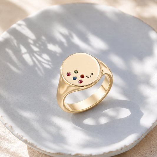 Gold signet ring with tiny H engraving