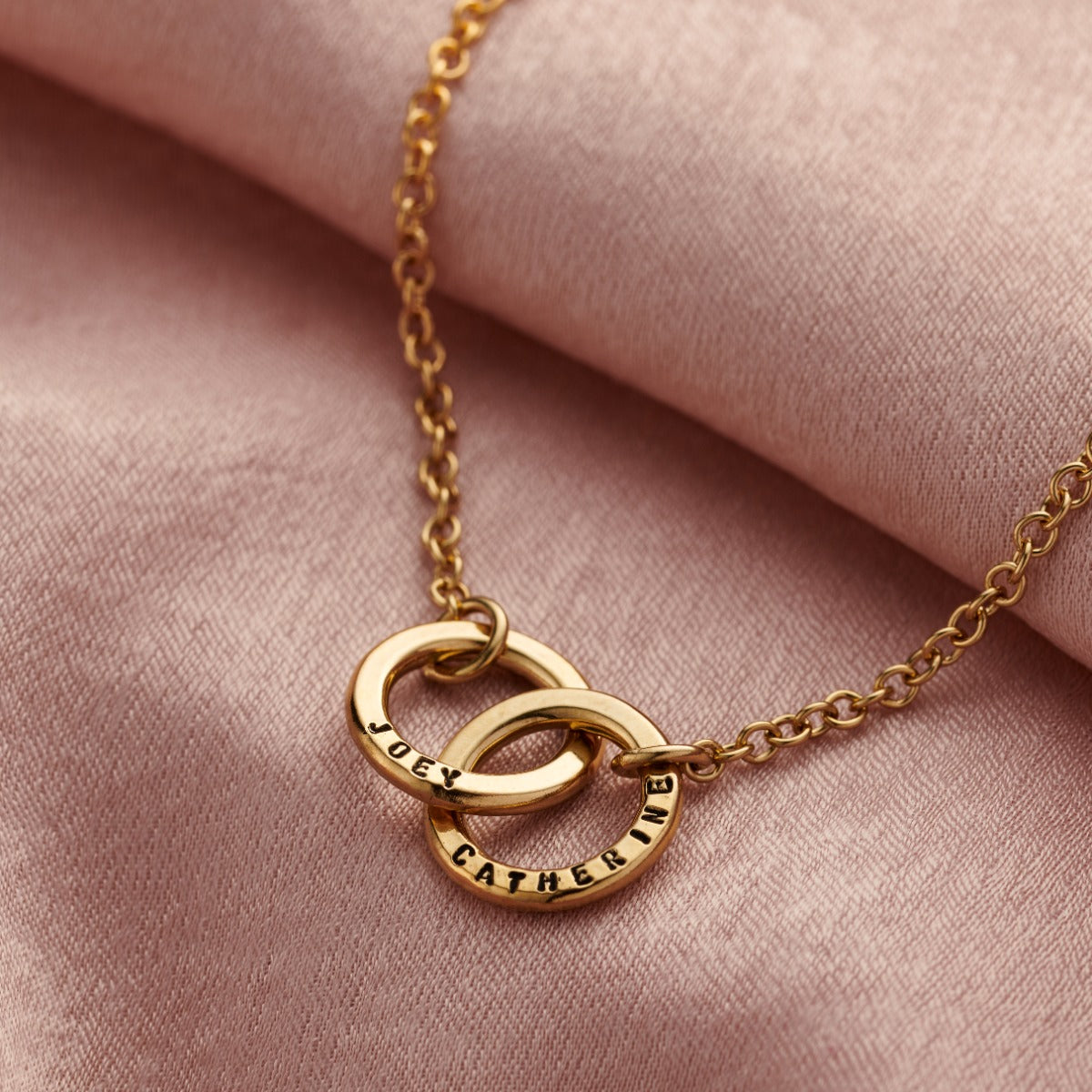 Back view of the gold personalised double hoop two names bracelet