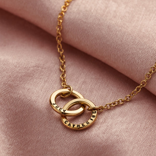 Back view of the gold personalised double hoop two names bracelet
