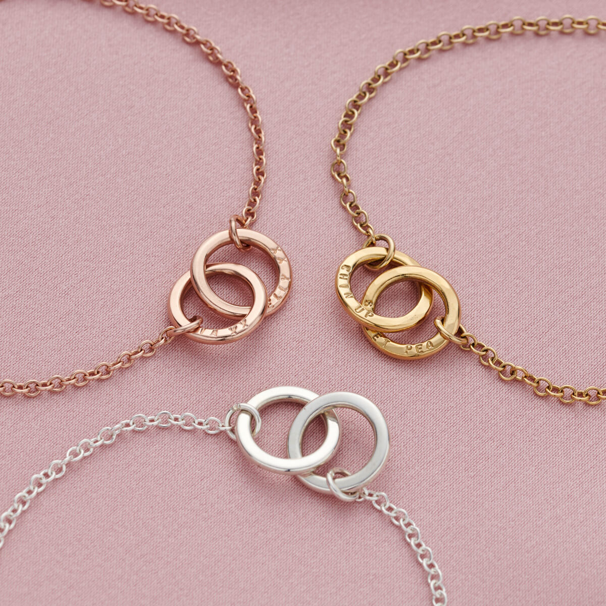Personalised double hoop two names bracelets in a group