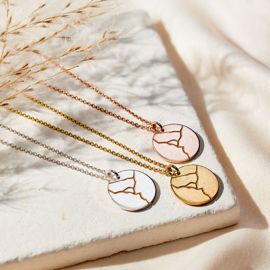 Personalised Kintsugi disc necklaces in a group