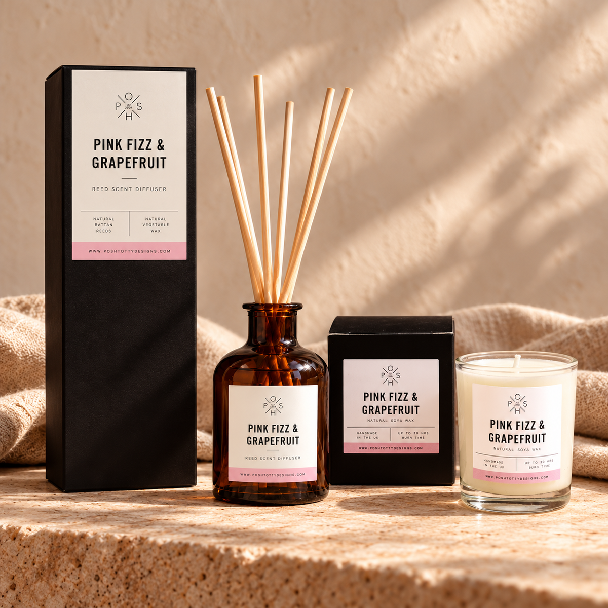Pink Fizz & Grapefruit 9cl candle and 100ml reed diffuser staged together with their individual boxes